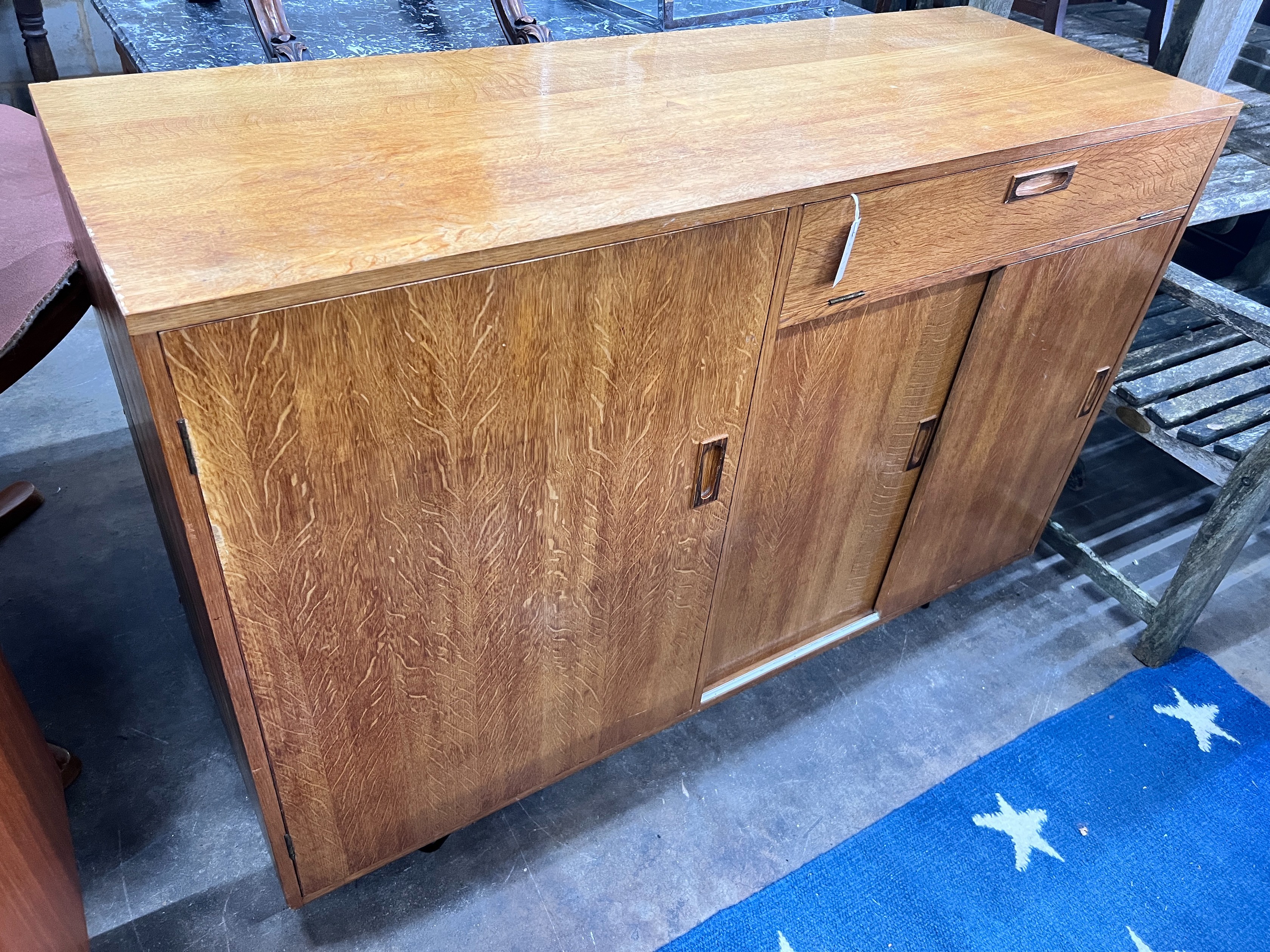 A mid century golden oak sideboard, width 140cm *Please note the sale commences at 9am.